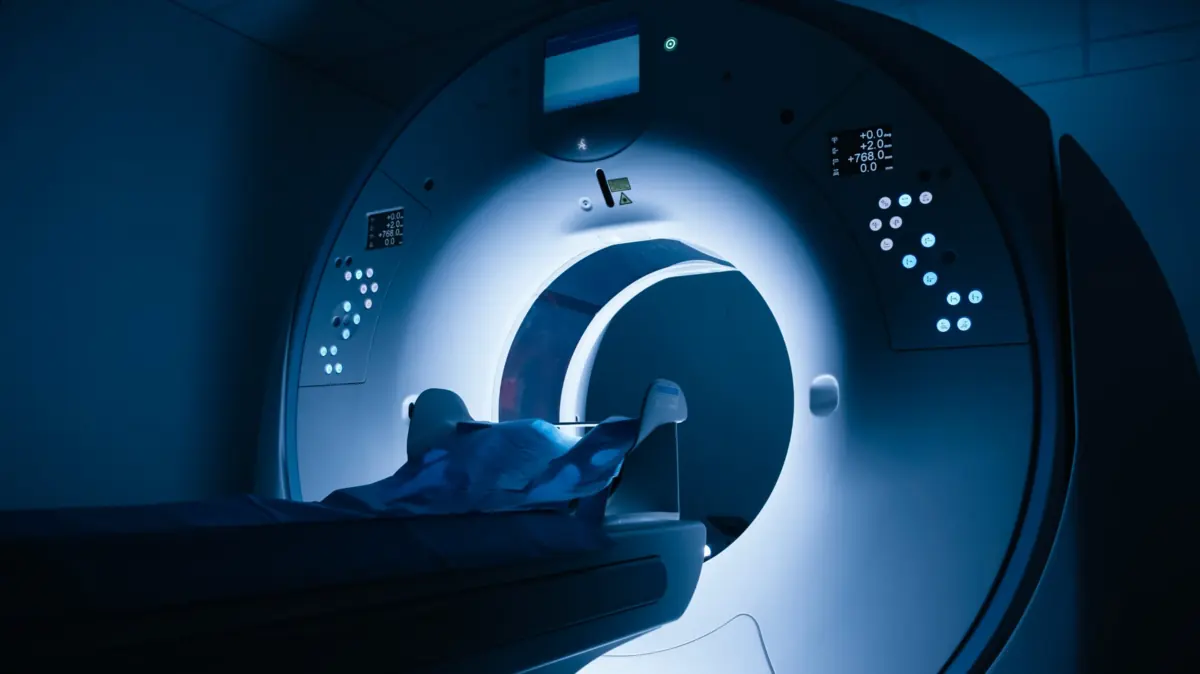 MRI scanner in a hospital imaging suite, view of the gantry and patient table